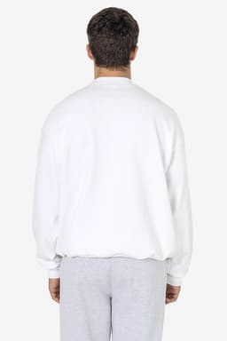 A white heavy fleece pullover viewed from the back, featuring a relaxed fit and long sleeves.