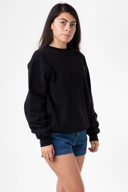 A black heavy fleece pullover jumper displayed on a model wearing denim shorts. The pullover has a logo.