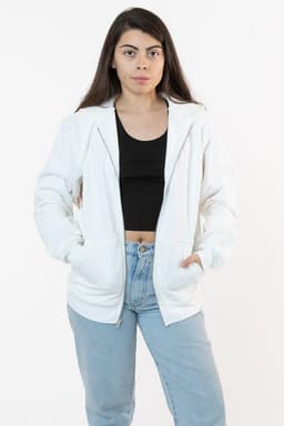 A white heavy fleece zip-up hoodie featuring side pockets, paired with a black top and light blue jeans.