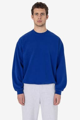A blue heavy fleece pullover jumper featuring long sleeves and a relaxed fit, worn by a model.