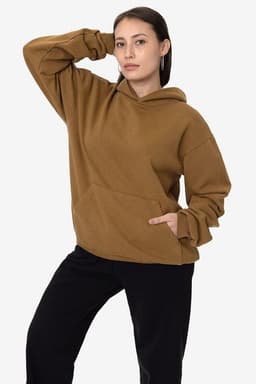 A brown heavy fleece hooded pullover with a front pocket, worn by a model posing in casual attire.