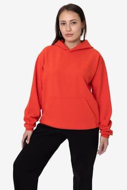 A heavy fleece hooded pullover in vibrant red, featuring long sleeves and a front pocket, modelled by a woman.