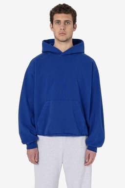A blue heavy fleece hooded pullover is worn by a model, featuring a front pocket and a relaxed fit.