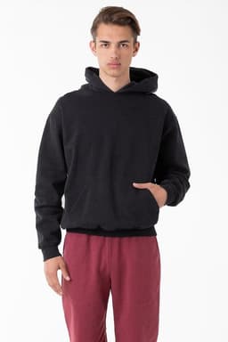 A heavy fleece hooded pullover in black, featuring a front pocket and a relaxed fit, paired with maroon pants.