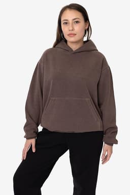 A hooded pullover in a muted brown colour, featuring a front pocket and a relaxed fit. It has a small logo on it.