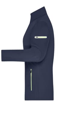 A ladies softshell jacket in navy with light green zip details and a logo on the arm.