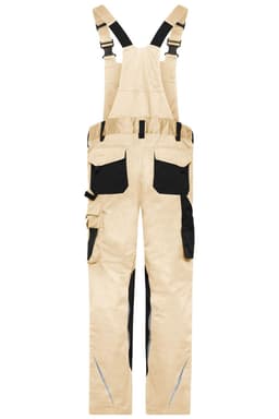 Workwear pants with bib in a beige colour, featuring black accents and multiple pockets. Includes adjustable straps and a branding logo.