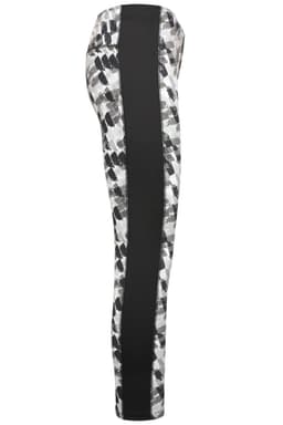Ladies sports tights featuring a patterned design in black and white with a contrasting black side panel. Includes branding.