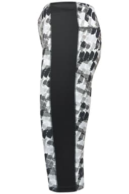 Ladies' 3/4 tights featuring a black and white abstract pattern with a solid black side panel. Includes branding.