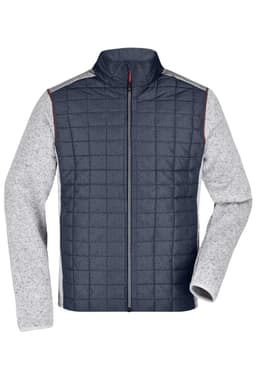A knitted hybrid jacket in navy and grey, featuring a zip front and quilted design with contrasting sleeves.