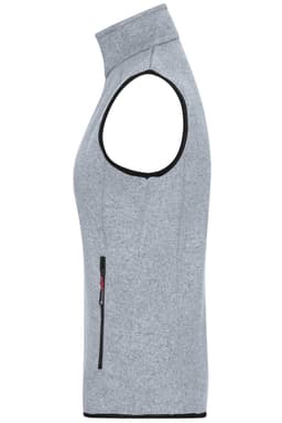 A grey knitted fleece vest with a high collar and a side zip pocket. It features an additional logo detail.