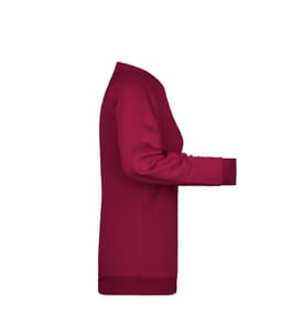 A maroon ladies sweat jumper with a relaxed fit and ribbed cuffs, featuring a logo on the sleeve.