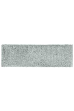 A soft grey Terry headband with a plush texture, featuring a branding logo.