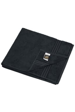 A black sauna sheet with a textured surface, neatly folded with a label in the corner.