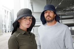 A black and navy cap with a wide neck guard, worn by a man and woman in casual clothing.
