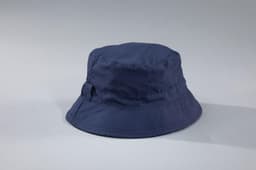 A navy bucket hat with a wide brim. The hat features a logo on its side.