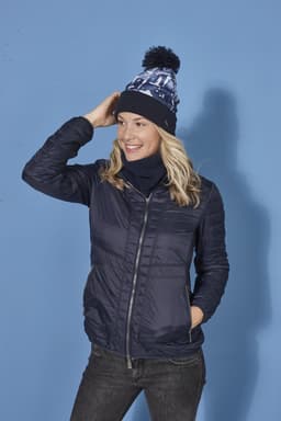 A woman wearing a navy jacket and a matching beanie, complemented by a navy Thinsulate™ neckwarmer.
