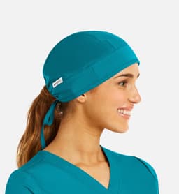 A unisex scrub cap in vibrant teal, featuring a logo and a tie for secure fitting.