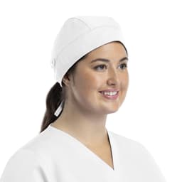 A unisex white scrub cap with buttons, featuring a woman smiling while wearing it.