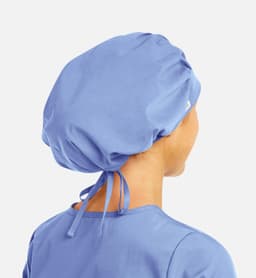 A blue unisex bouffant cap with a tied back, suitable for uniforms or medical use.