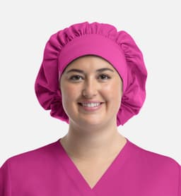 A unisex bouffant scrub cap in vibrant pink, featuring a gathered design and a comfortable fit.