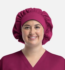 A unisex bouffant cap in a rich burgundy colour, featuring a gathered design and smooth finish.