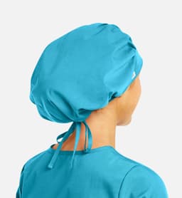 A turquoise unisex bouffant scrub cap with a tie at the back, part of a uniform collection.