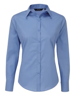 A light blue women's poplin long-sleeve blouse with a button-up front and a collar. It features a logo on the label.