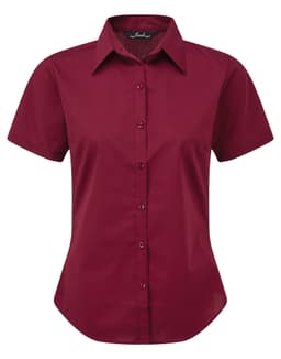 A burgundy women's button-up blouse with a collar and short sleeves, featuring a logo.