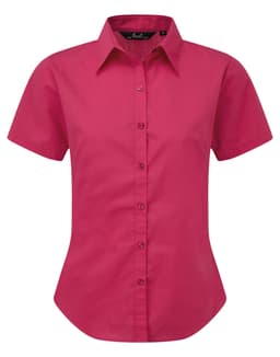 A short-sleeved button-up shirt in bright pink, featuring a classic collar and a fitted design. It has a logo on the side.