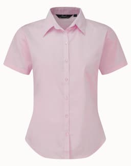 A pink button-up blouse with a collared neckline and short sleeves, featuring a branded label.