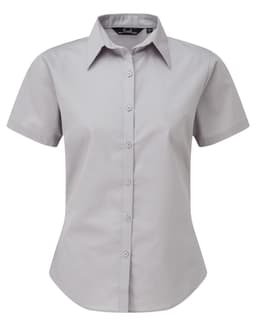 A grey women's short-sleeve poplin blouse with a button-up front and collar, featuring a branded logo.