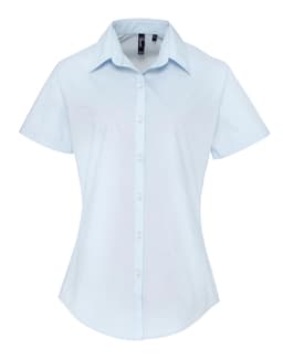 A light blue women's button-up shirt with short sleeves and a collar, featuring a logo.