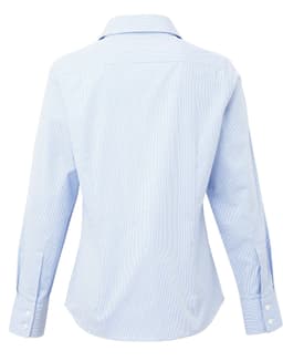 A light blue women's button-up shirt with a microcheck pattern, featuring long sleeves and a collar. It has a logo.