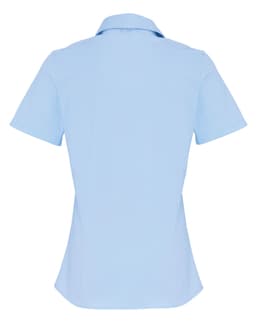 A light blue women's short-sleeve button-up shirt with a fitted design and a collar, featuring a logo.