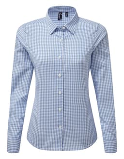 A blue and white check button-up shirt with a collar and long sleeves, featuring a logo.