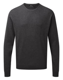 A crew neck sweater in dark grey, featuring long sleeves and a simple design. It has a small logo on the neckline.