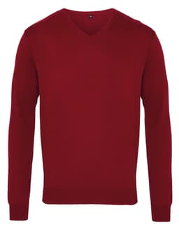 A red V-neck sweater with long sleeves and a ribbed hem, featuring a logo on the label.