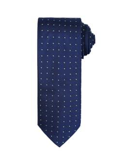 A navy tie featuring a micro dot pattern in contrasting colours, neatly rolled for display.