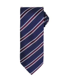A Waffle Stripe Tie featuring navy blue with white and maroon diagonal stripes. Includes a branding logo.