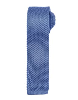 A slim knitted tie in a light blue shade with a textured finish. It features a logo on the label.