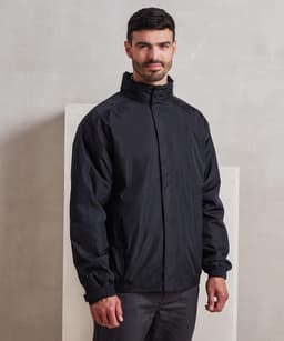 A black waterproof jacket with a high collar and elastic cuffs, featuring a logo. Suitable for rain protection.