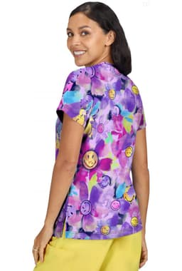 A vibrant purple top featuring a floral design with smiley face accents, showcasing a model from the back.