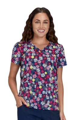 A floral print top featuring a navy background with multi-coloured flowers. The model is smiling and wearing the shirt.