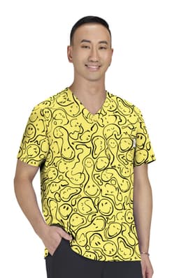 A bright yellow top featuring a playful print with various shapes and lines, worn by a man. It has a logo.