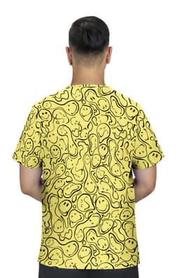 A yellow T-shirt featuring a playful pattern of smiling faces, displayed from the back. It has a logo on the front.