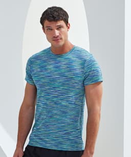 A performance t-shirt in shades of blue and green with a space dye pattern, featuring a logo on the front.