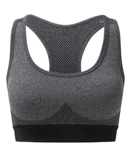 A seamless sports bra in grey with a mesh design and racerback style, featuring a black band at the bottom.