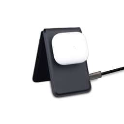 A black magnetic card wallet and wireless charging stand holding white wireless earbuds, connected by a charging cable.