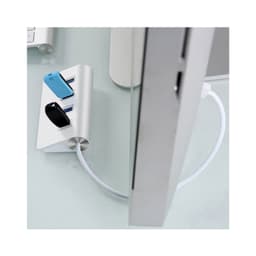 A USB hub in silver and blue, featuring four ports, connected to a computer with a white cable.